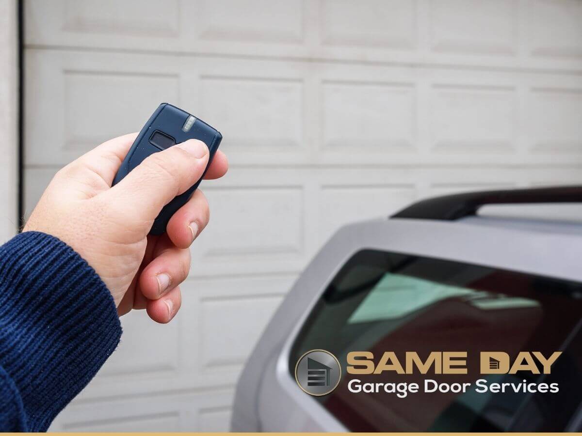 young woman use remote controller for closing and opening garage door