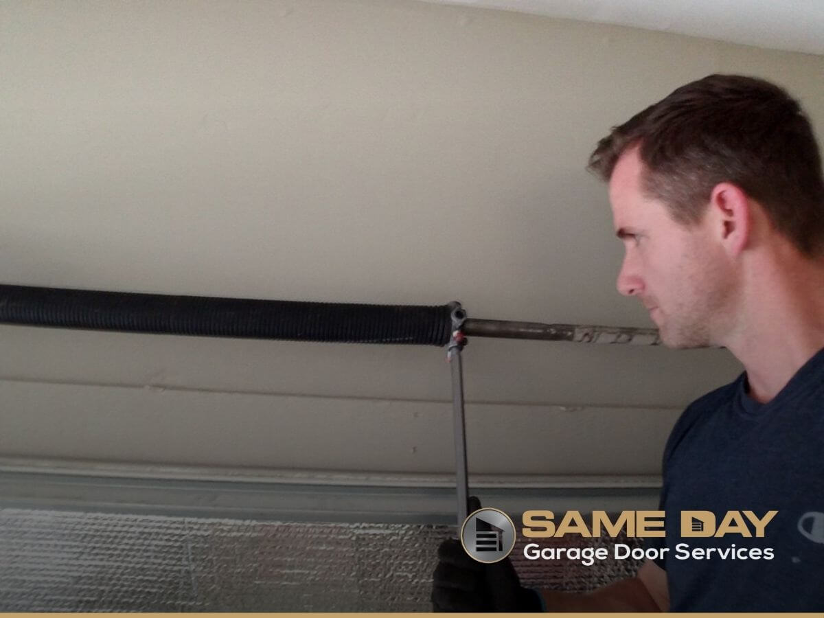 Same day garage door service repaired on a house dent in Gilbert